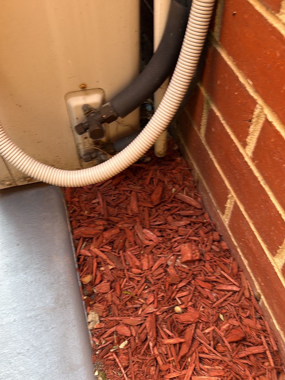 Air conditioner condensate running straight onto the ground, found during a building and pest inspection in Newport