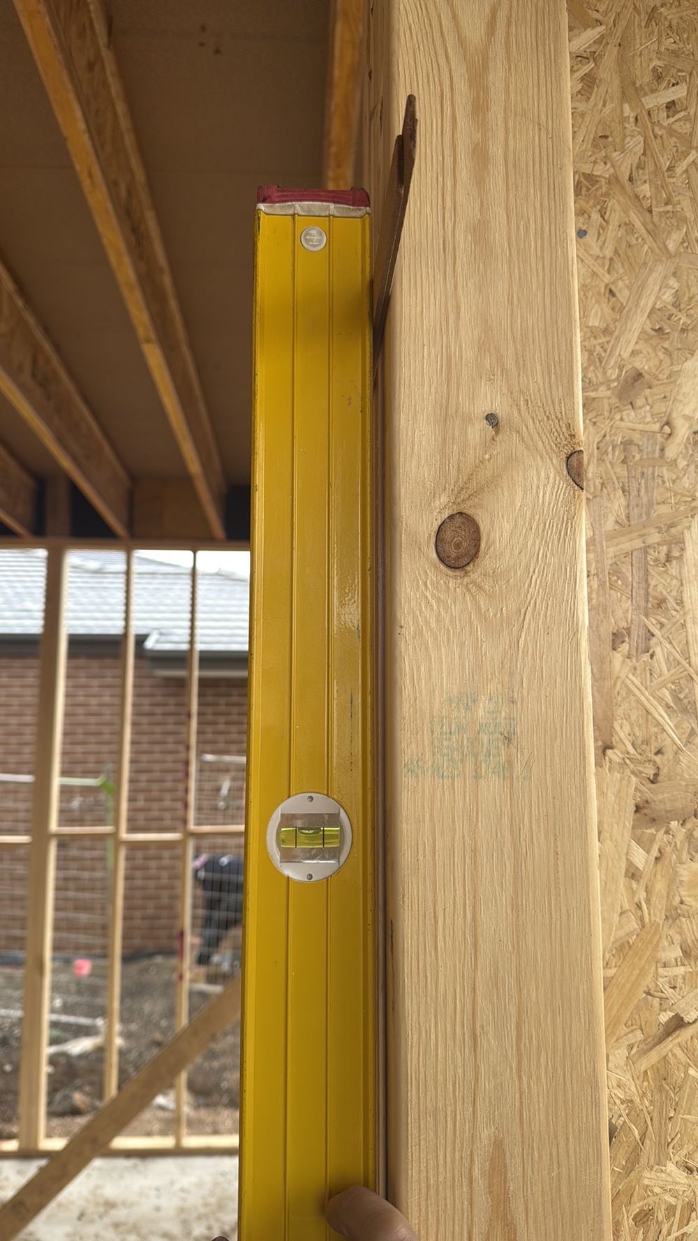 Wall frame leaning out of vertical by more than the 5mm tolerance, found during a frame inspection in Mambourin