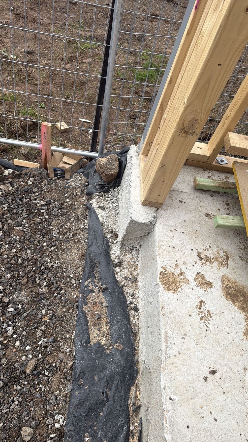 Slab projecting over 20mm beyond the timber wall, so it needs trimming back, found during a frame inspection in Mambourin