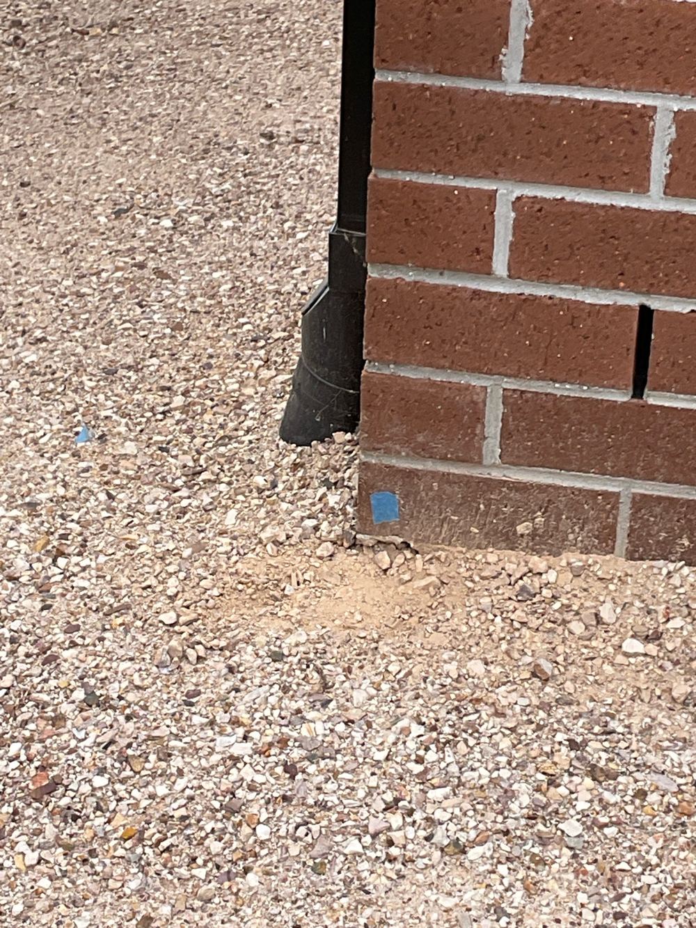 Brickwork overhanging the slab edge by more than 15mm, found during a pre-handover inspection in Mambourin