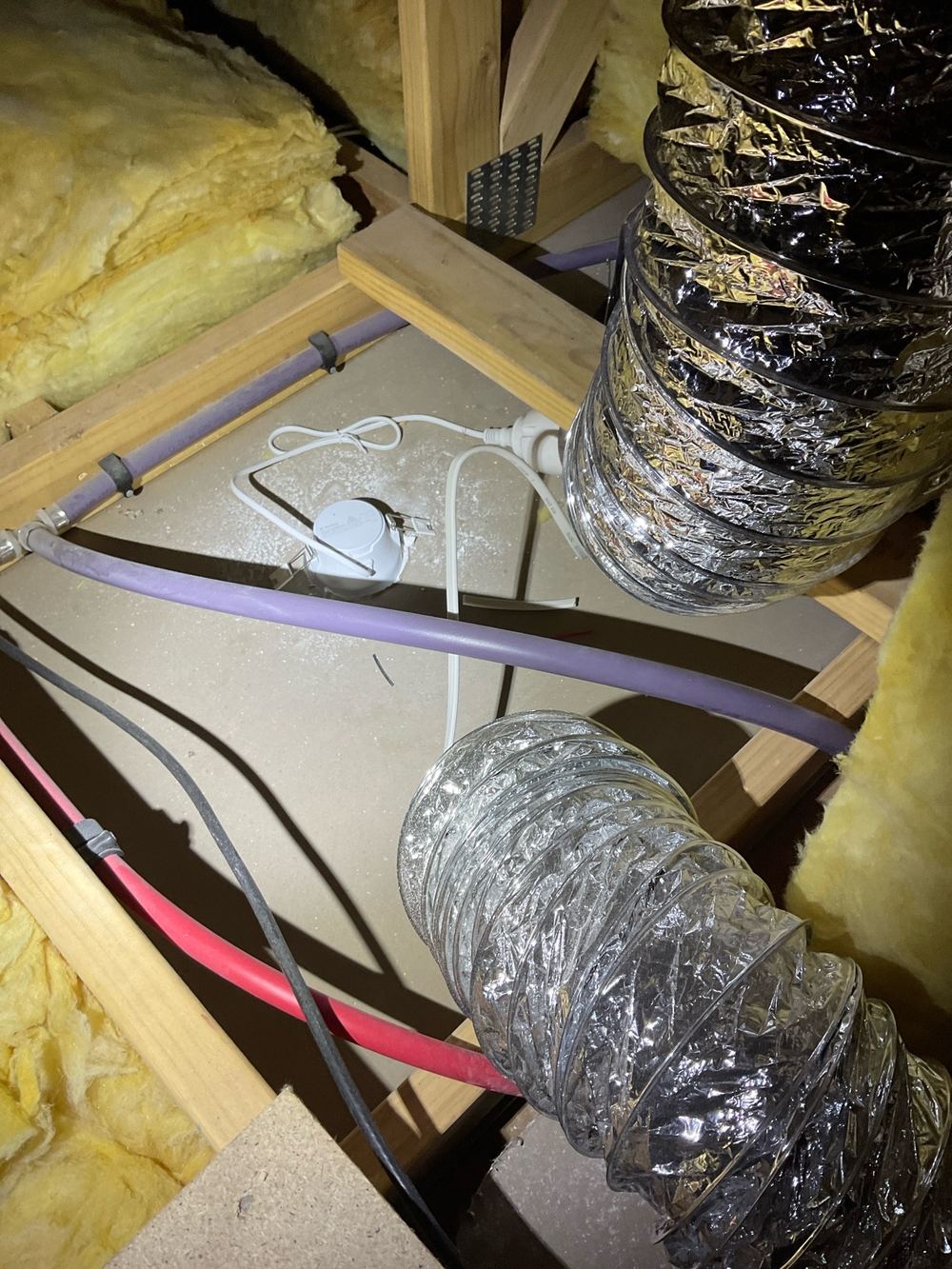 Exhaust fan venting into the roof space instead of outside, found during a pre-handover inspection in Mambourin