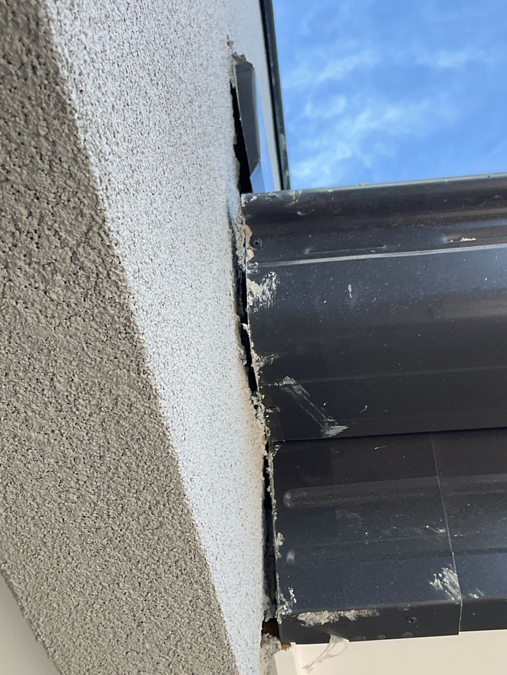 Gaps in the external walls needing caulking to keep water out, found during a pre-handover inspection in Mambourin