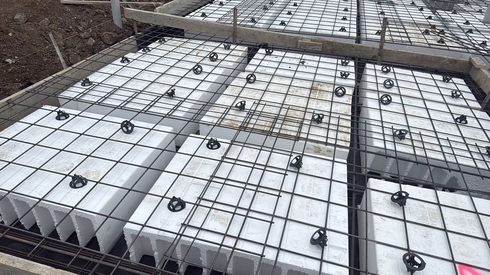 Reinforcement needing extra bar chairs before concrete, to hold the specified cover, found during a slab pre-pour inspection in Mambourin