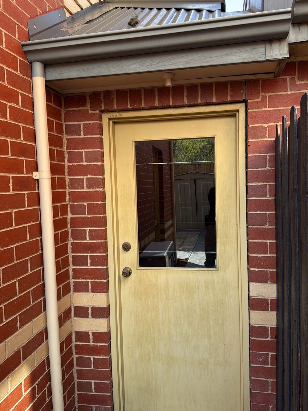 Brickwork cracking beside the rear garage door, pointing to structural movement, found during a pre-purchase inspection in Newport